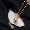 Celebrate your special occasions with 24K Gold Plated Oval Cage Pendant and chain with AD.